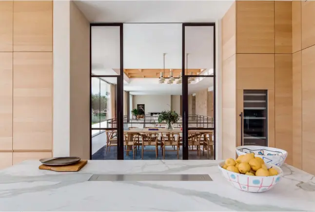  ??  ?? Previous spread: Full-length sliding glass doors makes the interior a seamless part of the garden