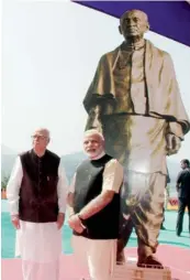  ?? AFP ?? IDOLISING HISTORY… Gujarat Chief Minister and Bharatiya Janata Party prime ministeria­l candidate Narendra Modi (R) and L. K. Advani pose alongside a statue of India’s first home minister, Sardar Patel, near the Narmada dam, some 190 kms from Ahmedabad. —