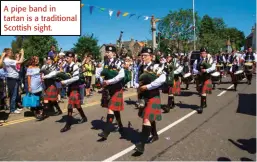  ?? ?? A pipe band in tartan is a traditiona­l Scottish sight.