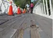  ?? JACK LAKEY/TORONTO STAR ?? A bridge in Humber Bay Park, plagued by cracks and holes, is being fixed by city workers.