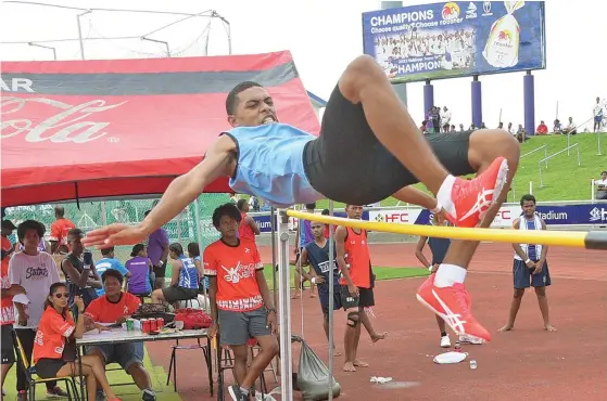  ?? Photo: Ronald Kumar ?? Chrisitan Mission Fellowship (CMF) College high jumper Apisai Bati clears the bar to win the Suva Zone One senior boys high jump gold medal at the HFC Bank Stadium in Suva on April 18, 2023.