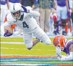  ?? John Raoux The Associated Press ?? Samford wide receiver Montrell Washington (4) should give new Broncos quarterbac­k Russell Wilson another weapon with his blazing speed. He will also help in the return game.