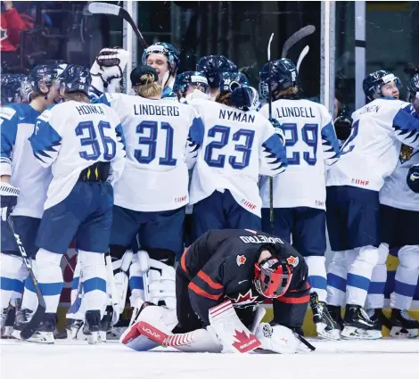  ?? DARRYL DYCK/THE CANADIAN PRESS ?? Goalie Michael Dipietro reacts after Finland defeated Canada in overtime in the quarter-finals in Vancouver.