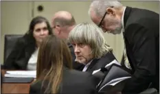  ?? FREDERIC J. BROWN/POOL PHOTO VIA AP ?? David Allen Turpin (second from right) and his attorney David Macher (far right) appear in court for an arraignmen­t in Riverside on Thursday.