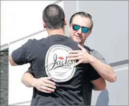  ?? Nikolas Samuels/The Signal ?? Garrett Holcombe, right, and Jesse Heyer meet for the first time Thursday at The Signal’s offices in Santa Clarita after assisting people at the Las Vegas shooting together.