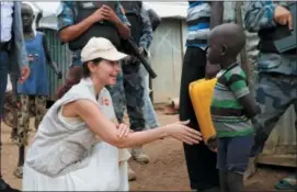  ?? SAM MEDNICK — THE ASSOCIATED PRESS ?? Actress Ashley Judd meets a refugee boy in Juba, South Sudan, Thursday.