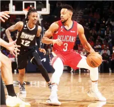 ?? — AFP photo ?? CJ McCollum of the New Orleans Pelicans dribbles the ball during the game against the Memphis Grizzlies.