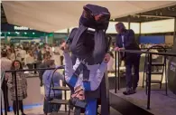  ?? — AP ?? A visitor enjoys a Samsung virtual reality experience during the Mobile World Congress show in Barcelona on Tuesday.