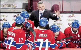  ?? CANADIAN PRESS FILE PHOTO ?? Montreal Canadiens coach Martin St. Louis talks with players during first period NHL hockey action the Buffalo Sabres in Montreal in February.