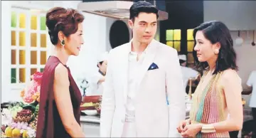  ??  ?? Scene in ‘Crazy Rich Asians’ starring Michelle Yeo (left to right), Henry Golding and Constance Wu.