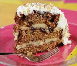  ??  ?? This cake earns its name: (Best Ever) Carrot Cake. It’s loaded with calories — and worth every one.