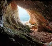  ??  ?? The teardrop opening of Paviland Cave, where a skeleton was found, believed to have been a male who died at approximat­ely 21 years of age.