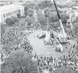  ?? STEVE HELBER/ASSOCIATED PRESS FILE ?? This July 1, 2020, file photo shows workers preparing to remove the statue of Confederat­e General Stonewall Jackson from its pedestal on Monument Avenue in Richmond.