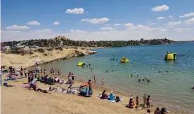  ?? COURTESY OF CITY OF FARMINGTON ?? The sandy beach at Farmington Lake is a nice place for a family to relax.