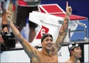  ?? MATTHIAS SCHRADER / AP ?? Caeleb Dressel won the 100-meter freestyle in 47.02 seconds — a mere six-hundredths ahead of defending champ Kyle Chalmers of Australia.