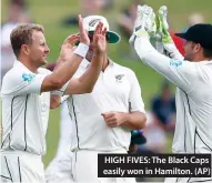  ??  ?? HIGH FIVES: The Black Caps easily won in Hamilton. (AP)