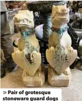  ??  ?? > Pair of grotesque stoneware guard dogs