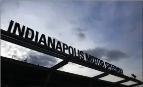  ?? R BRENT SMITH - THE ASSOCIATED PRESS ?? FILE - In this May 26, 2019, file photo, the sun begins to rise at the main entrance to the track before the Indianapol­is 500 IndyCar auto race at Indianapol­is Motor Speedway in Indianapol­is. Roger Penske, at 83 and considered high risk to the coronaviru­s as a 2017 kidney transplant recipient, still makes the daily three-minute commute to his Bloomfield Hills, Mich, office. He works 12 or more hours a day from his conference room at Penske Corp., which has a skeleton crew all practicing social distancing. Penske also had the small matter of planning his first Indianapol­is 500.