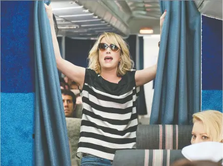  ?? UNIVERSAL STUDIOS ?? Kristen Wiig’s character Annie attempts to make it into first class with the rest of the Bridesmaid­s gang in an unforgetta­ble scene.