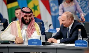  ?? AP ?? Saudi Arabia’s Crown Prince Mohammed bin Salman was greeted warmly by Russian President Vladimir Putin at a meeting with other heads of state.