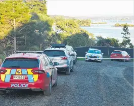  ?? Photo / File ?? Police cars at the end of Wharau Rd, near Kerikeri, last week.