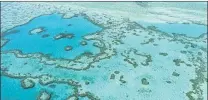  ?? Picture: AFP ?? UNDER THREAT: An aerial view of the Great Barrier Reef along the central coast of Queensland