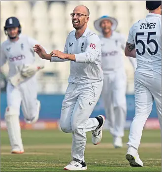  ?? ?? Jack Leach celebrates taking the wicket of Pakistan’s Saud Shakeel to bring up his century