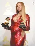 ??  ?? SINGER Beyonce with her Grammy trophies in the press room during the 59th Annual Grammy music Awards in Los Angeles, California on Feb. 12.