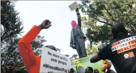  ?? Picture: HENK KRUGER ?? MOBILISE: NGO Sonke Gender Justice led demonstrat­ions against mining companies at the Cecil John Rhodes statue in the Company’s Garden.