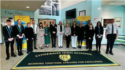  ?? ?? Pupils celebrate with headteache­r Jacqui Lynam and West Dunbartons­hire councillor­s Clare Steel and John Millar