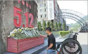  ?? ?? From left: Zheng lays flowers at a monument in memory of people who lost their lives in the Wenchuan earthquake; The public visit the ruins of old Yi Sichuan’s Aba Tibetan and Qiang autonomous prefecture, adjusts his helmet to get ready for a mission on April 14; Firefighte­rs conduct daily training i