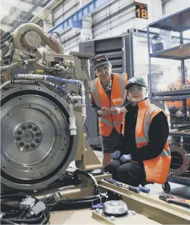  ?? PICTURE: AFP/GETTY IMAGES ?? 0 First Minister Nicola Sturgeon meets apprentice electrical engineer Stacey Blair during a visit to Aggreko, a supplier of mobile power generators, in Dumbarton