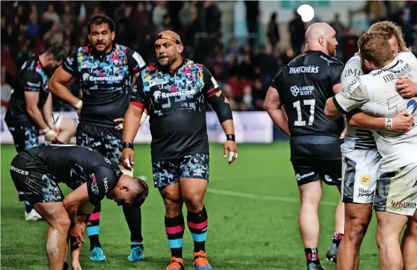  ?? ?? Sale players celebrate and Bristol players show their disappoint­ment at the end of Friday night’s game at Ashton Gate