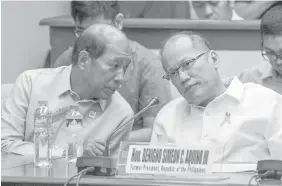  ?? PHILSTAR FILE PHOTO ?? Former president Benigno Simeon Aquino III listens to former Budget secretary Florencio Abad during congressio­nal hearing on Dengvaxia vaccine controvers­y.