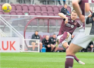  ?? ?? Stephen Kingsley bends home a free-kick to put Hearts two up against Motherwell