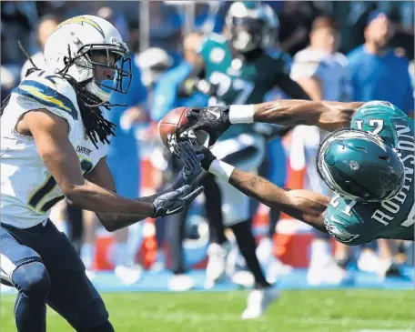  ?? Wally Skalij Los Angeles Times ?? THE EAGLES’ Patrick Robinson dives to break up a pass intended for Chargers receiver Travis Benjamin in the first quarter Sunday.