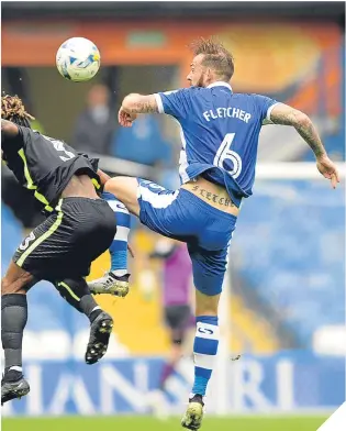  ??  ?? Steven Fletcher in action, sporting the No.6 assigned to him by Sheffield Wednesday’s Thai owner, Dejphon Chansiri.
