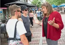  ?? — Reuters ?? My name is Christine: Hallquist speaking with Ben Watts and Nate Jarvis while campaignin­g in Burlington, Vermont.
