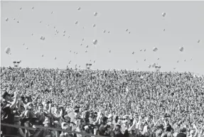  ?? AP FILE PHOTO BY NATI HARNIK ?? Balloons are often released at college football games, such as this 2015 Southern Miss-Nebraska game in Lincoln, Neb.