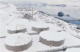  ?? ALYESKA PIPELINE SERVICE CO. ?? A drone photograph shows snow covering 62-foot-tall and acre-wide oil tanks March 16 at the Valdez Marine Terminal in Alaska.