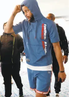  ?? Scott Strazzante / The Chronicle ?? The Warriors’ Stephen Curry made a fashion statement as he arrived for a team breakfast and media session in Portland.