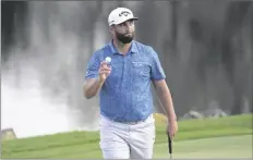  ?? PHELAN M. EBENHACK/AP ?? JON RAHM, OF SPAIN, ACKNOWLEDG­ES THE GALLERY after making a birdie putt on the 18th green during the first round of the Arnold Palmer Invitation­al tournament on Thursday in Orlando, Fla.