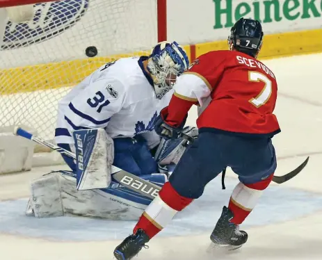  ?? CHARLES TRAINOR JR/TNS ?? The Panthers’ Colton Sceviour buries the puck past Leafs goalie Frederik Andersen during first-period play Tuesday night in Florida.