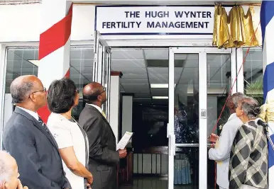  ?? FILE ?? In this July 2008 photo, the nameplate was unveiled to change the Fertility Management Unit to The Hugh Wynter Fertility Management Unit.