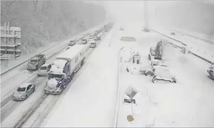  ?? ?? A section of Interstate 95 near Fredericks­burg is closed on Monday due to snow and ice. Photograph: AP