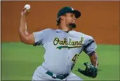  ?? TOM PENNINGTON — GETTY IMAGES, FILE ?? The A’s Frankie Montas pitches against the Rangers in the bottom of the first inning on Sept. 13 in Arlington, Texas.