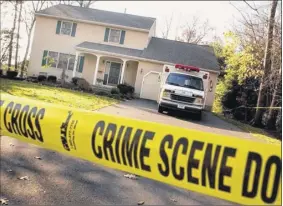  ?? Steve Jacobs / times union archive ?? Crime scene tape blocks entry to the house at 36 Brockley St. in delmar where Peter Porco was found dead and his wife Joan was found badly injured in August 2004.