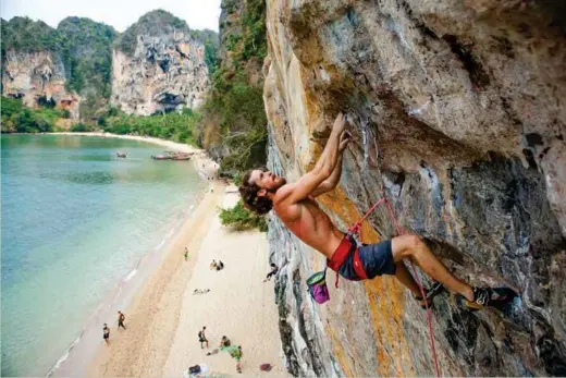  ??  ?? Paul Szaroz on Jai Dum, 31, a steep test-piece on the beach-climbing wonderland of Tonsai, Thailand, where a poor curry can leave in a tight pickle, mid-way up a rock face