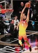 ?? Rob Gray / Associated Press ?? Jayson Tatum dunks in the All-star Game on Sunday in Salt Lake City. Tatum scored a record 55 points and was named the game’s MVP.