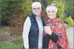  ?? (NWA Democrat-Gazette/Carin Schoppmeye­r) ?? Tamara Gilmour (left) and Cookie Redfern enjoy the Greening of the Garden.